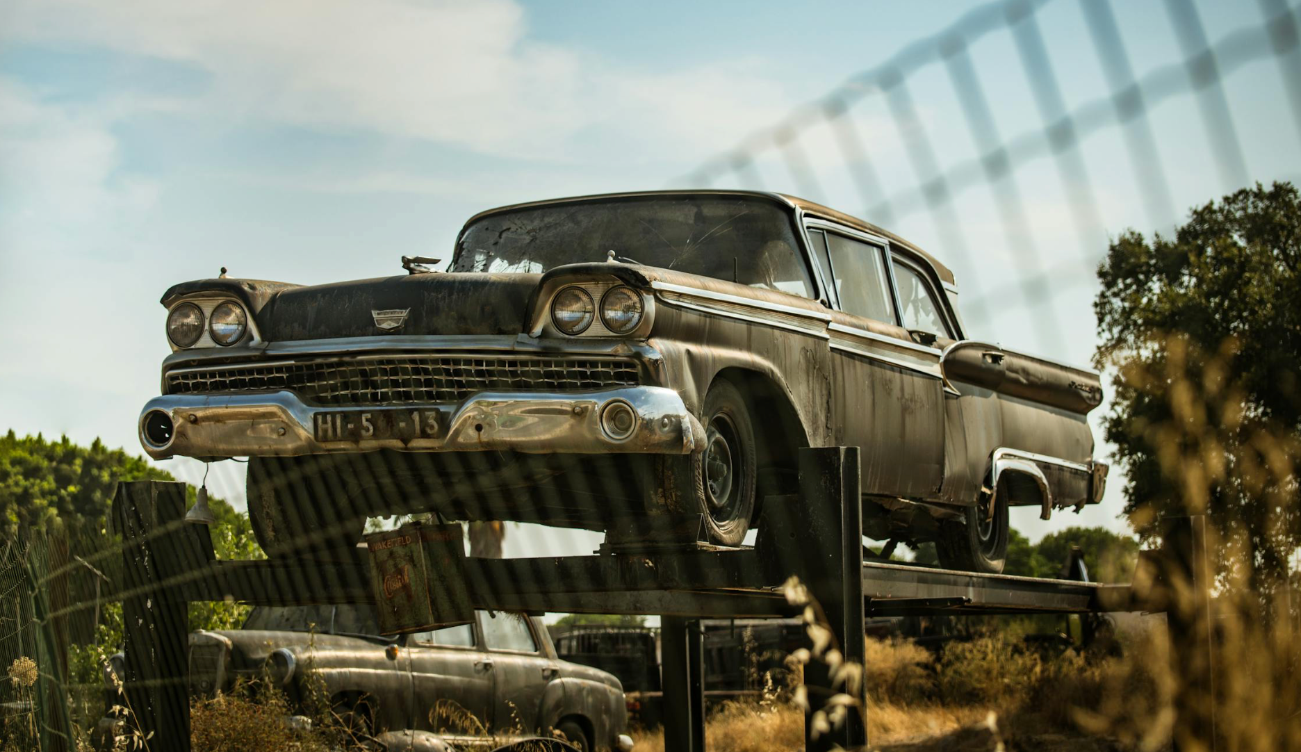Abandoned old car in a scrap yard